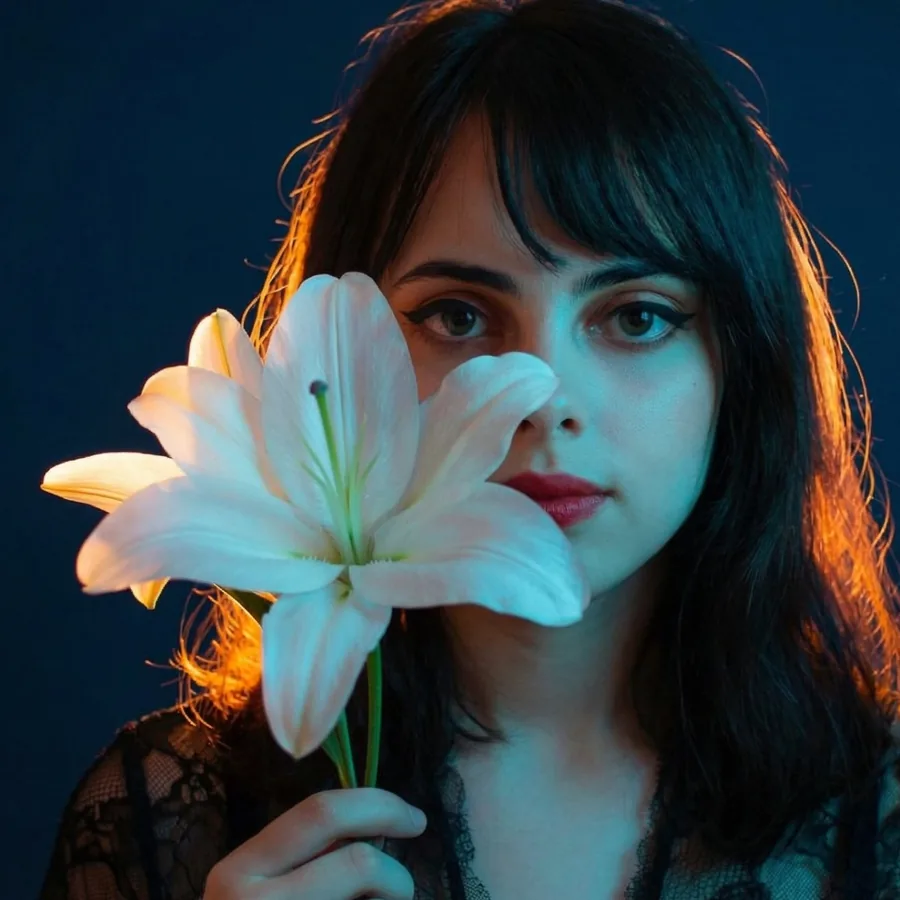 Lily holding a white lily